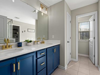 Modern living room showcasing the benefits of interior vinyl wrapping with sleek wood and marble finishes.