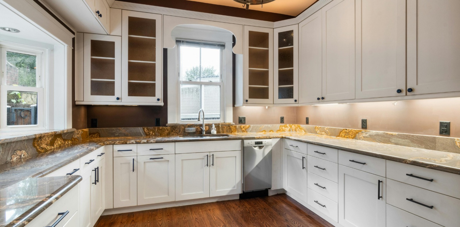 Vinyl wrapped cabinets in a modern kitchen maintained by the Best Interior Wrapping Services Dubai